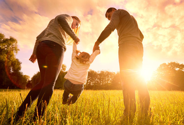 Family walking at sunset